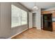 Eat-in kitchen featuring wood cabinets, laminate floors, and pantry at 1735 Deer Crossing Cir, Jonesboro, GA 30236