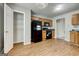 Well-lit kitchen with black appliances, laminate floors, and plenty of storage at 1735 Deer Crossing Cir, Jonesboro, GA 30236