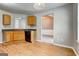 Practical kitchen featuring wood cabinets, laminate floors, and black appliances at 1735 Deer Crossing Cir, Jonesboro, GA 30236