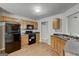 Functional kitchen boasts oak cabinets, laminate floors, and ample counter space at 1735 Deer Crossing Cir, Jonesboro, GA 30236
