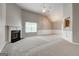 Spacious living room with a fireplace, large window, neutral walls, and newer carpeting at 1735 Deer Crossing Cir, Jonesboro, GA 30236