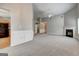 Open living room showcases fireplace, new carpet, and flows into the kitchen at 1735 Deer Crossing Cir, Jonesboro, GA 30236