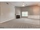 Spacious living room with fireplace, ceiling fan and carpet floors at 1735 Deer Crossing Cir, Jonesboro, GA 30236
