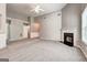 Expansive living room featuring neutral paint, fireplace, newer carpeting, and lots of light at 1735 Deer Crossing Cir, Jonesboro, GA 30236