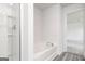 Bright bathroom showcases a large tub and a separate glass-enclosed shower with modern fixtures at 102 Avondale Blvd, Conyers, GA 30013