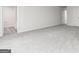 This bedroom features neutral carpet, many doorways, and a neutral paint scheme at 102 Avondale Blvd, Conyers, GA 30013