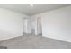 Bedroom featuring neutral carpet and multiple doorways creating an open feel at 102 Avondale Blvd, Conyers, GA 30013