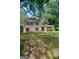 Charming two-story home with a well-maintained lawn and mature trees at 491 Allana Ct, Stone Mountain, GA 30087