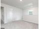 Carpeted room with window and open doorway at 282 Limestone Circle, Conyers, GA 30013