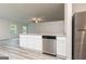 Modern kitchen with white cabinetry, stainless steel appliances, granite countertops and hard surface floors at 282 Limestone Circle, Conyers, GA 30013
