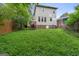 Spacious backyard featuring a lush lawn and mature trees, offering plenty of room for outdoor activities at 1484 Mcpherson Se Ave, Atlanta, GA 30316