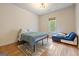 Bright bedroom features hardwood floors, a full-sized bed, and a window that offers lots of natural light at 1484 Mcpherson Se Ave, Atlanta, GA 30316