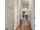 Hallway featuring hardwood flooring and arched entryway into the kitchen at 1484 Mcpherson Se Ave, Atlanta, GA 30316