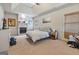 Spacious main bedroom features a fireplace, tray ceilings, carpet flooring, and windows with natural light at 1484 Mcpherson Se Ave, Atlanta, GA 30316
