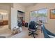 Well-lit office space featuring a desk and chair, closet, and large windows offering lots of natural light at 1484 Mcpherson Se Ave, Atlanta, GA 30316