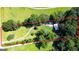 Aerial view showcasing the property's expansive land, landscaping, and home at 1833 S Highway 92, Fayetteville, GA 30215