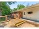 Backyard featuring a wooden deck, table and chairs for outdoor dining or relaxing at 1833 S Highway 92, Fayetteville, GA 30215