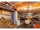 Spacious unfinished basement with visible ceiling pipes and concrete support beams at 1833 S Highway 92, Fayetteville, GA 30215
