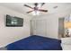 Cozy bedroom showcasing a ceiling fan, television, and a closet for storage at 1833 S Highway 92, Fayetteville, GA 30215