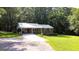 Quaint brick home with a carport and well-maintained front yard and shady trees at 1833 S Highway 92, Fayetteville, GA 30215