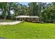 Charming one-story brick home with a metal roof and spacious front lawn at 1833 S Highway 92, Fayetteville, GA 30215