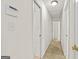 Hallway with carpet flooring, white walls, and doors to other rooms in the house at 1833 S Highway 92, Fayetteville, GA 30215