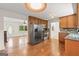 Kitchen featuring hardwood floors, stainless steel appliances, and wooden cabinets at 1833 S Highway 92, Fayetteville, GA 30215