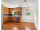 Kitchen featuring stainless steel dishwasher, wooden cabinets and granite countertops at 1833 S Highway 92, Fayetteville, GA 30215