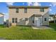 Two-story house with a door in the middle and a backyard of grass at 2655 Virginia Cv, Riverdale, GA 30296