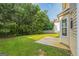 Picturesque backyard showcasing lush greenery and a concrete patio, perfect for outdoor enjoyment at 2655 Virginia Cv, Riverdale, GA 30296