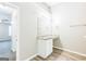 Bright bathroom featuring a granite countertop vanity, framed mirror, and wood-look vinyl floors at 2655 Virginia Cv, Riverdale, GA 30296