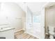 Bright bathroom with a soaking tub and large vanity area at 2655 Virginia Cv, Riverdale, GA 30296