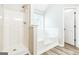 Bathroom with a walk-in shower, a soaking tub, and vinyl floors at 2655 Virginia Cv, Riverdale, GA 30296