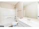 Clean bathroom with a tub-shower combo, toilet, and sink with a bright mirror at 2655 Virginia Cv, Riverdale, GA 30296