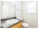 Bathroom featuring a large mirror, granite counters, and a window at 2655 Virginia Cv, Riverdale, GA 30296