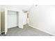 Spacious bedroom with plush carpet flooring, closet, and doorways leading to other rooms at 2655 Virginia Cv, Riverdale, GA 30296