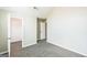 Spacious bedroom featuring plush carpet flooring, closet, and doorways leading to other rooms at 2655 Virginia Cv, Riverdale, GA 30296