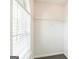 Bedroom closet with a storage shelf and window for natural lighting at 2655 Virginia Cv, Riverdale, GA 30296