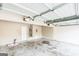 Spacious garage with a door, water heater and electrical panel at 2655 Virginia Cv, Riverdale, GA 30296