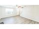 Bright, open living room featuring new hard surface floors, neutral paint, and a ceiling fan at 2655 Virginia Cv, Riverdale, GA 30296
