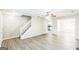 Bright and airy living room with new hard surface floors and staircase leading upstairs at 2655 Virginia Cv, Riverdale, GA 30296