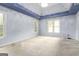 Large bedroom with tray ceiling, multiple windows, and neutral carpet, ready for customization at 539 Riverbirch Trce, Stone Mountain, GA 30087