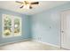 Cozy bedroom featuring a ceiling fan, window view and light blue painted walls at 539 Riverbirch Trce, Stone Mountain, GA 30087