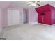 Large bedroom featuring a ceiling fan, double closet and pink painted walls at 539 Riverbirch Trce, Stone Mountain, GA 30087