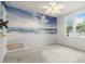 Bedroom featuring a ceiling fan, a window and a mural on the wall at 539 Riverbirch Trce, Stone Mountain, GA 30087