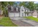 Charming two-story home with a covered front porch, attached two-car garage and a spacious driveway at 539 Riverbirch Trce, Stone Mountain, GA 30087