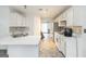 The kitchen has white cabinets, stainless steel appliances and sleek countertops that add style to the space at 539 Riverbirch Trce, Stone Mountain, GA 30087