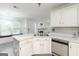 The kitchen boasts white cabinets, modern countertops and stainless steel appliances, making it ideal for cooking at 539 Riverbirch Trce, Stone Mountain, GA 30087