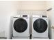 This laundry room is equipped with modern washer and dryer units and space-saving storage solutions at 539 Riverbirch Trce, Stone Mountain, GA 30087