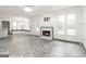 Inviting living room with fireplace and large windows, seamlessly connecting to a breakfast nook at 539 Riverbirch Trce, Stone Mountain, GA 30087